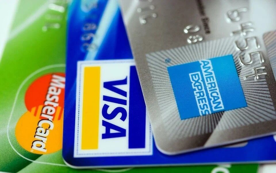 Credit cards including Visa, MasterCard, and American Express representing traditional casino payment methods for deposits and withdrawals